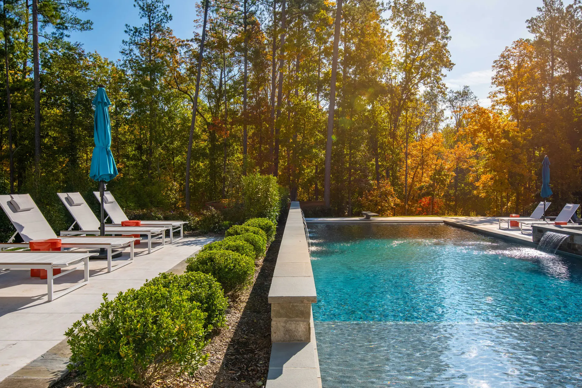 view of pool from deck chair